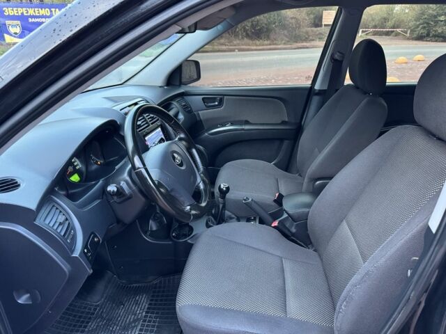 Чорний Кіа Sportage, об'ємом двигуна 2 л та пробігом 180 тис. км за 6700 $, фото 12 на Automoto.ua