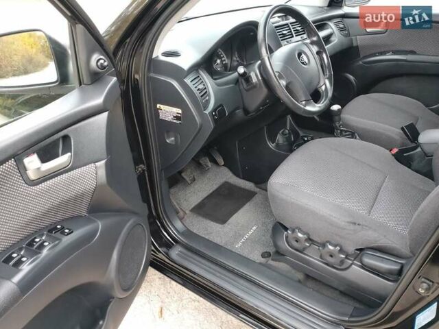 Чорний Кіа Sportage, об'ємом двигуна 2 л та пробігом 150 тис. км за 7000 $, фото 30 на Automoto.ua