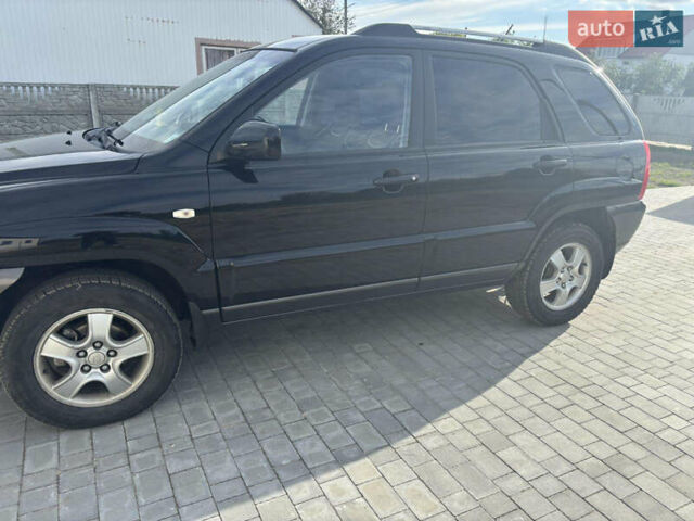 Черный Киа Sportage, объемом двигателя 2 л и пробегом 300 тыс. км за 6800 $, фото 2 на Automoto.ua