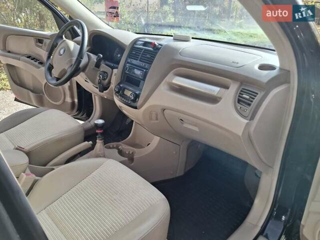 Черный Киа Sportage, объемом двигателя 1.99 л и пробегом 283 тыс. км за 6850 $, фото 44 на Automoto.ua
