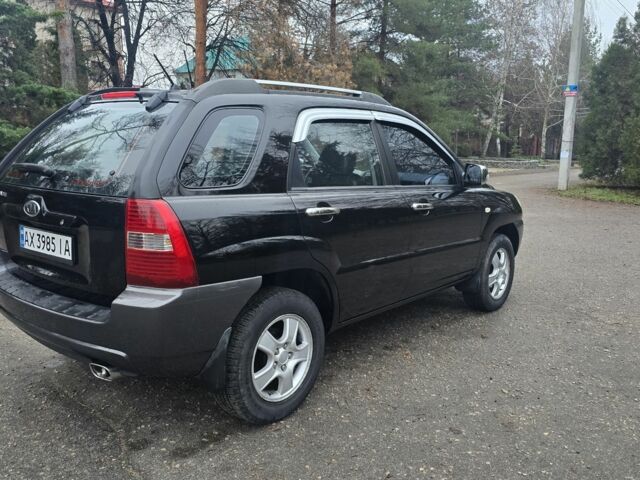 Чорний Кіа Sportage, об'ємом двигуна 2 л та пробігом 207 тис. км за 7000 $, фото 5 на Automoto.ua
