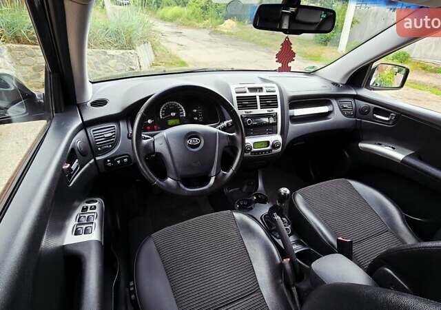 Чорний Кіа Sportage, об'ємом двигуна 2 л та пробігом 172 тис. км за 7999 $, фото 1 на Automoto.ua