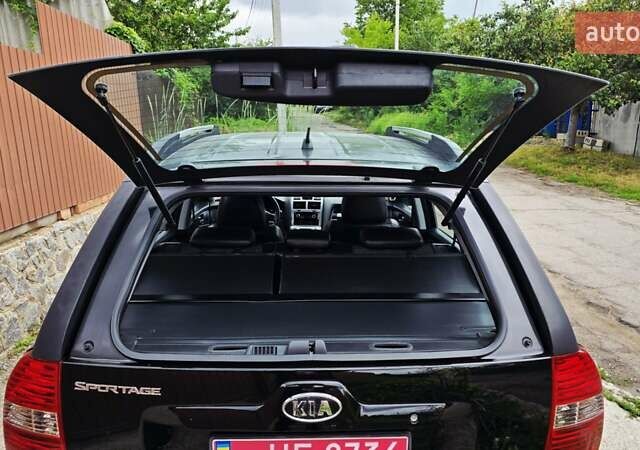 Чорний Кіа Sportage, об'ємом двигуна 2 л та пробігом 172 тис. км за 7999 $, фото 58 на Automoto.ua
