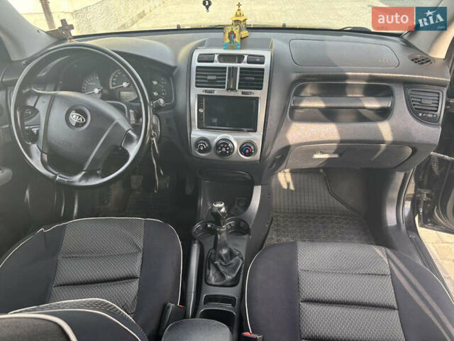Черный Киа Sportage, объемом двигателя 2 л и пробегом 300 тыс. км за 6800 $, фото 6 на Automoto.ua