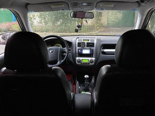 Чорний Кіа Sportage, об'ємом двигуна 2 л та пробігом 227 тис. км за 6900 $, фото 10 на Automoto.ua