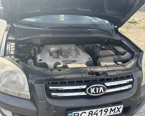 Черный Киа Sportage, объемом двигателя 2 л и пробегом 300 тыс. км за 6800 $, фото 12 на Automoto.ua