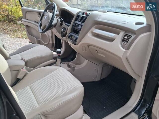 Черный Киа Sportage, объемом двигателя 1.99 л и пробегом 283 тыс. км за 6850 $, фото 45 на Automoto.ua