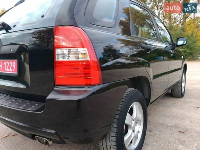Чорний Кіа Sportage, об'ємом двигуна 2 л та пробігом 150 тис. км за 7000 $, фото 21 на Automoto.ua