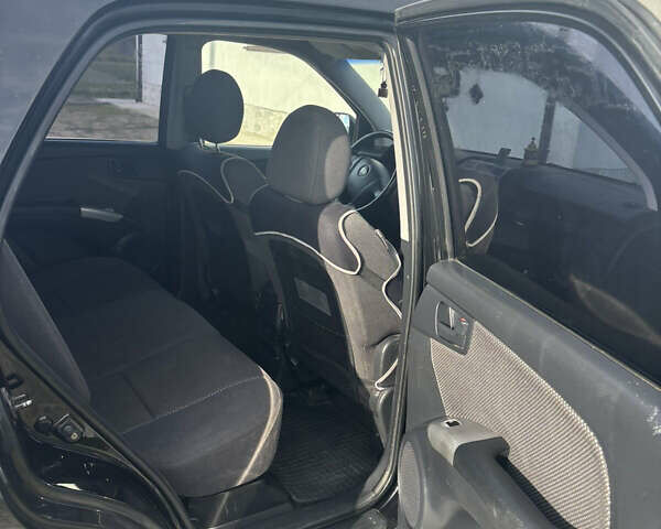 Черный Киа Sportage, объемом двигателя 2 л и пробегом 300 тыс. км за 6800 $, фото 5 на Automoto.ua