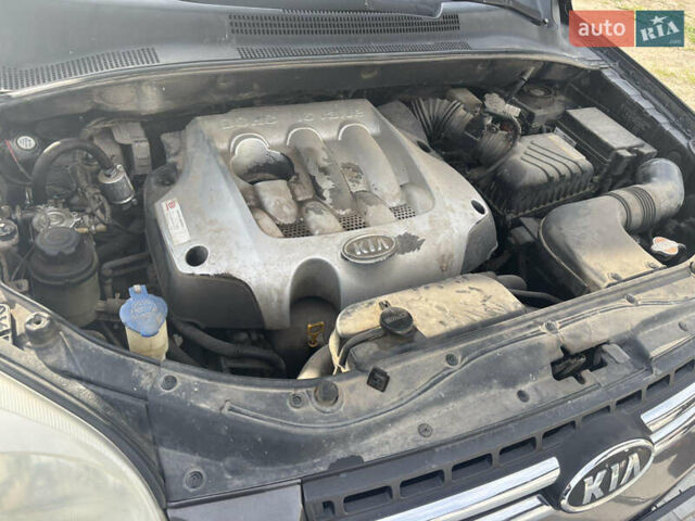 Черный Киа Sportage, объемом двигателя 2 л и пробегом 300 тыс. км за 6800 $, фото 8 на Automoto.ua