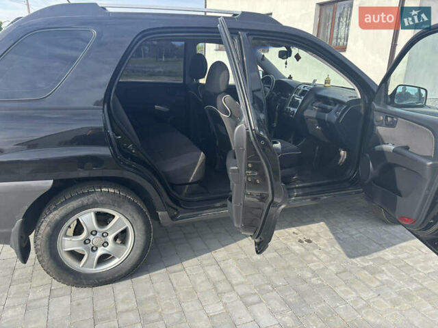 Черный Киа Sportage, объемом двигателя 2 л и пробегом 300 тыс. км за 6800 $, фото 7 на Automoto.ua