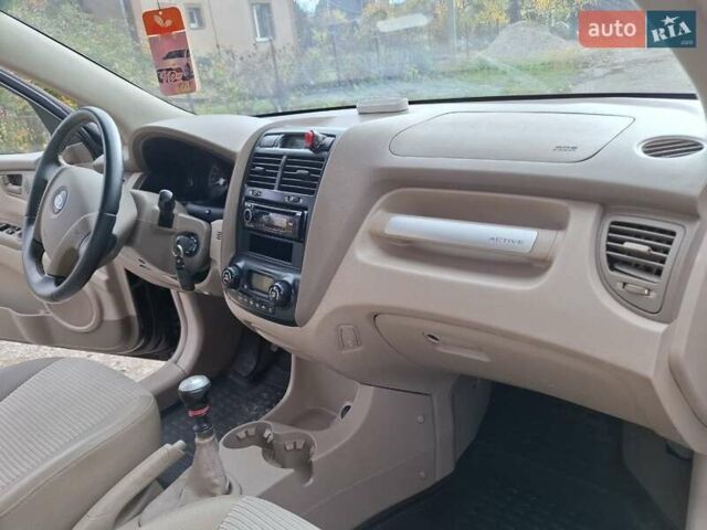 Черный Киа Sportage, объемом двигателя 1.99 л и пробегом 283 тыс. км за 6850 $, фото 55 на Automoto.ua