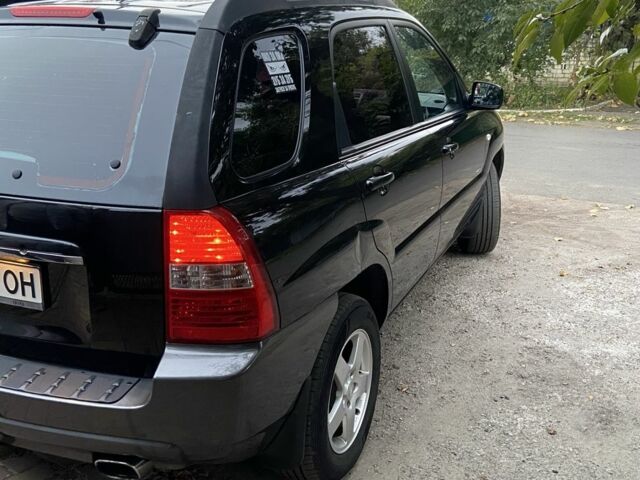 Чорний Кіа Sportage, об'ємом двигуна 2 л та пробігом 227 тис. км за 6900 $, фото 5 на Automoto.ua