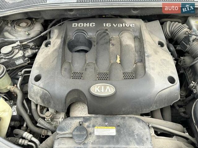 Черный Киа Sportage, объемом двигателя 2 л и пробегом 240 тыс. км за 7650 $, фото 94 на Automoto.ua