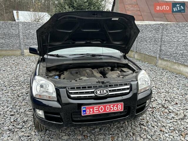 Черный Киа Sportage, объемом двигателя 2 л и пробегом 240 тыс. км за 7650 $, фото 89 на Automoto.ua