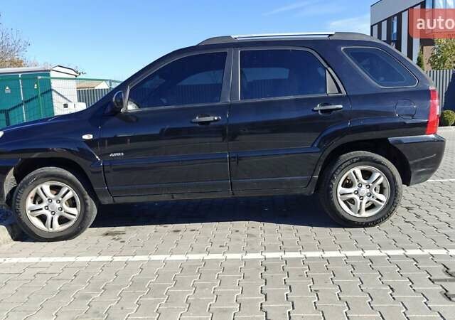 Черный Киа Sportage, объемом двигателя 1.98 л и пробегом 234 тыс. км за 8000 $, фото 11 на Automoto.ua