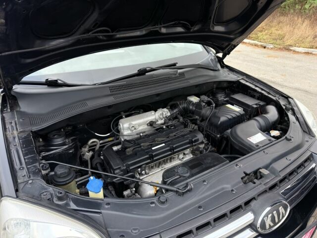 Черный Киа Sportage, объемом двигателя 2 л и пробегом 213 тыс. км за 8600 $, фото 23 на Automoto.ua