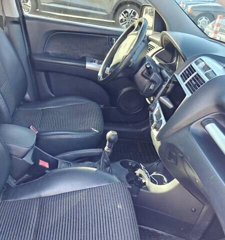 Черный Киа Sportage, объемом двигателя 1.98 л и пробегом 234 тыс. км за 8000 $, фото 13 на Automoto.ua