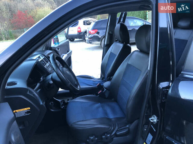 Черный Киа Sportage, объемом двигателя 2 л и пробегом 290 тыс. км за 7200 $, фото 20 на Automoto.ua