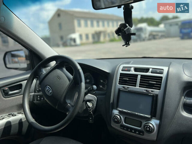 Черный Киа Sportage, объемом двигателя 2 л и пробегом 150 тыс. км за 10000 $, фото 9 на Automoto.ua