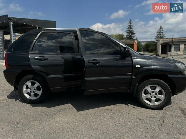 Черный Киа Sportage, объемом двигателя 2 л и пробегом 150 тыс. км за 10000 $, фото 1 на Automoto.ua