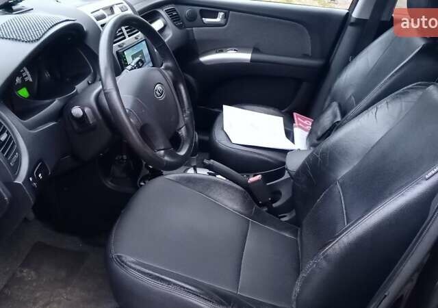 Черный Киа Sportage, объемом двигателя 2 л и пробегом 275 тыс. км за 7600 $, фото 14 на Automoto.ua