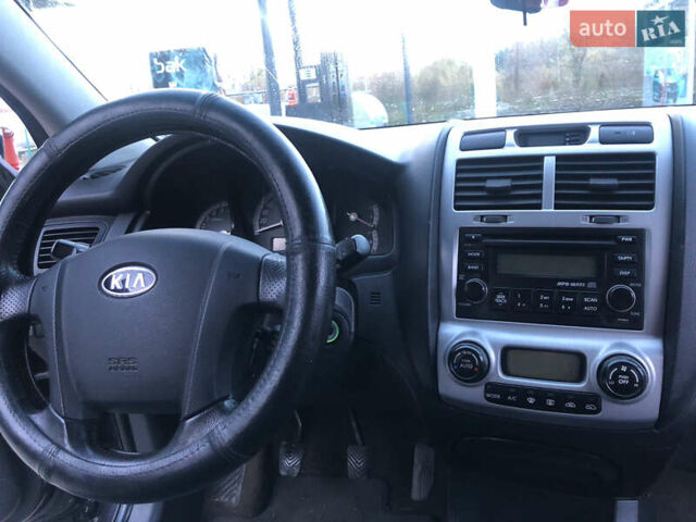 Черный Киа Sportage, объемом двигателя 2 л и пробегом 290 тыс. км за 7200 $, фото 18 на Automoto.ua