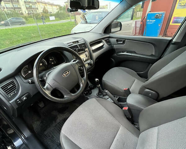 Черный Киа Sportage, объемом двигателя 1.98 л и пробегом 264 тыс. км за 6500 $, фото 37 на Automoto.ua