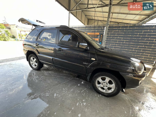 Черный Киа Sportage, объемом двигателя 2 л и пробегом 150 тыс. км за 10000 $, фото 16 на Automoto.ua