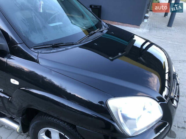 Черный Киа Sportage, объемом двигателя 2 л и пробегом 290 тыс. км за 7200 $, фото 2 на Automoto.ua
