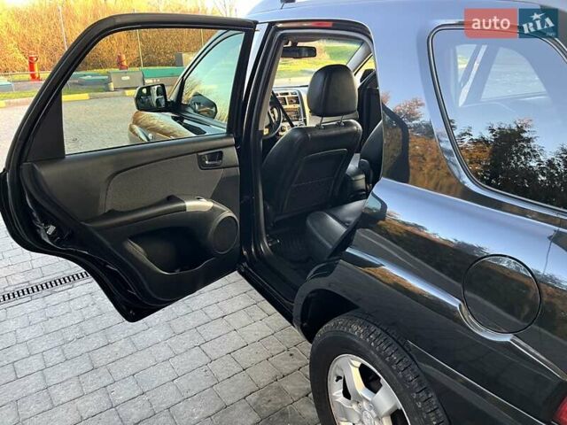Черный Киа Sportage, объемом двигателя 2 л и пробегом 226 тыс. км за 8800 $, фото 7 на Automoto.ua