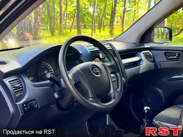 Черный Киа Sportage, объемом двигателя 2 л и пробегом 170 тыс. км за 7999 $, фото 4 на Automoto.ua