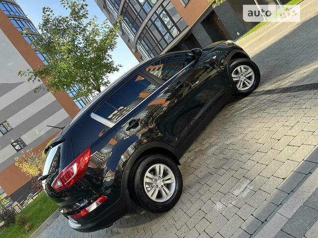 Чорний Кіа Sportage, об'ємом двигуна 2 л та пробігом 135 тис. км за 12450 $, фото 26 на Automoto.ua