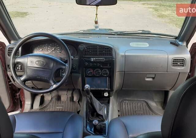 Фиолетовый Киа Sportage, объемом двигателя 2 л и пробегом 310 тыс. км за 4500 $, фото 5 на Automoto.ua