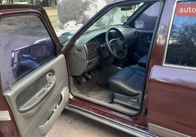 Фиолетовый Киа Sportage, объемом двигателя 2 л и пробегом 310 тыс. км за 4500 $, фото 4 на Automoto.ua