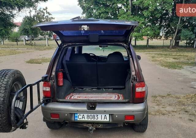 Фиолетовый Киа Sportage, объемом двигателя 2 л и пробегом 310 тыс. км за 4500 $, фото 6 на Automoto.ua