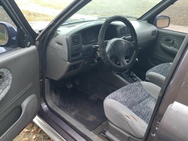 Фіолетовий Кіа Sportage, об'ємом двигуна 2 л та пробігом 200 тис. км за 3600 $, фото 7 на Automoto.ua