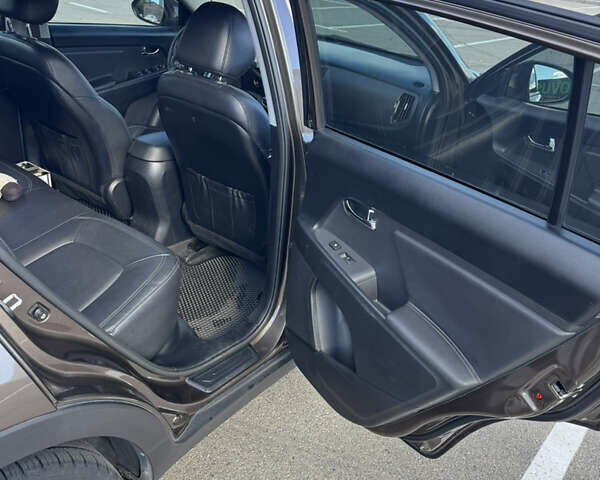 Коричневий Кіа Sportage, об'ємом двигуна 2 л та пробігом 188 тис. км за 14500 $, фото 11 на Automoto.ua