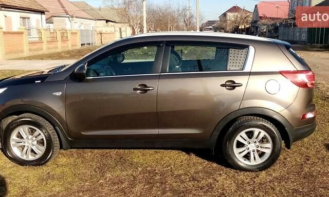 Коричневий Кіа Sportage, об'ємом двигуна 2 л та пробігом 103 тис. км за 12500 $, фото 4 на Automoto.ua