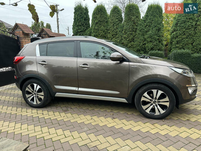 Коричневий Кіа Sportage, об'ємом двигуна 2 л та пробігом 197 тис. км за 14800 $, фото 2 на Automoto.ua