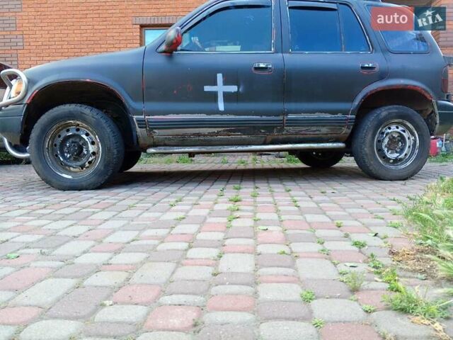 Красный Киа Sportage, объемом двигателя 2 л и пробегом 309 тыс. км за 3300 $, фото 3 на Automoto.ua