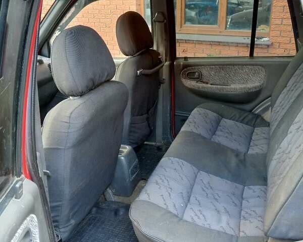 Красный Киа Sportage, объемом двигателя 2 л и пробегом 309 тыс. км за 3300 $, фото 8 на Automoto.ua