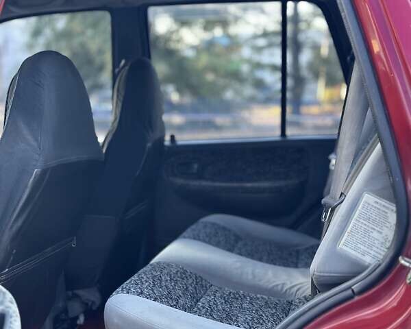 Красный Киа Sportage, объемом двигателя 2 л и пробегом 350 тыс. км за 2999 $, фото 11 на Automoto.ua