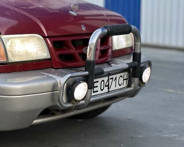 Красный Киа Sportage, объемом двигателя 2 л и пробегом 350 тыс. км за 2999 $, фото 6 на Automoto.ua