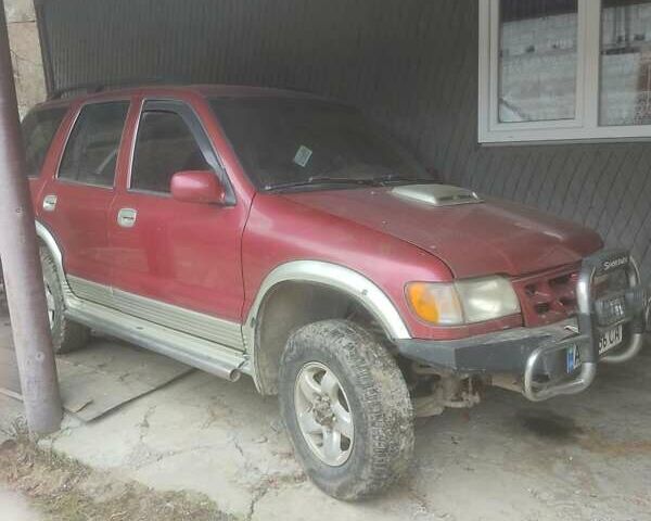 Красный Киа Sportage, объемом двигателя 2 л и пробегом 260 тыс. км за 3200 $, фото 4 на Automoto.ua