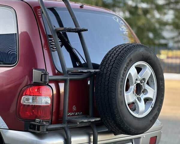 Красный Киа Sportage, объемом двигателя 2 л и пробегом 350 тыс. км за 2999 $, фото 8 на Automoto.ua