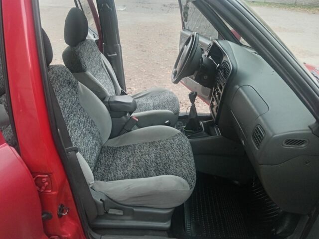 Червоний Кіа Sportage, об'ємом двигуна 2 л та пробігом 200 тис. км за 1310 $, фото 6 на Automoto.ua