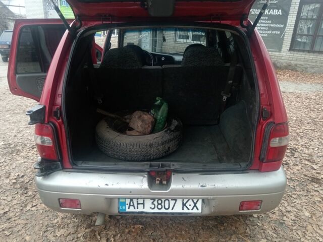 Червоний Кіа Sportage, об'ємом двигуна 2 л та пробігом 200 тис. км за 1310 $, фото 7 на Automoto.ua