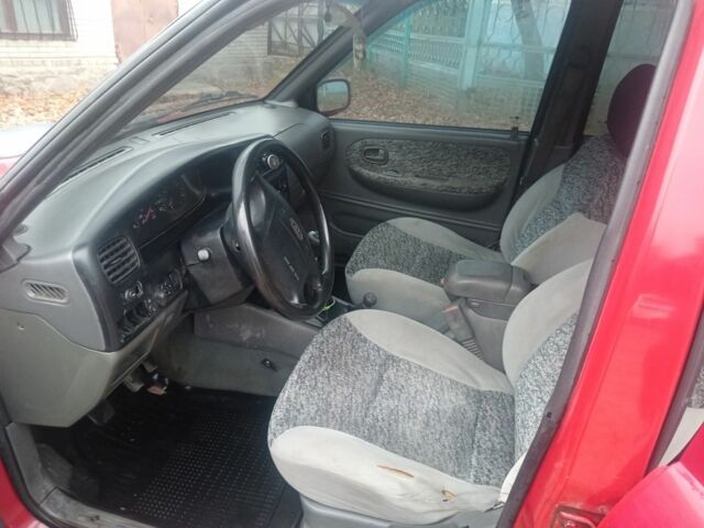 Червоний Кіа Sportage, об'ємом двигуна 2 л та пробігом 200 тис. км за 1310 $, фото 5 на Automoto.ua