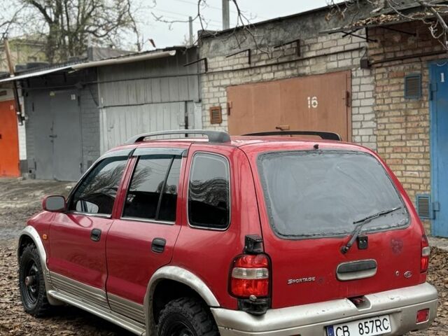 Красный Киа Sportage, объемом двигателя 2 л и пробегом 200 тыс. км за 1000 $, фото 7 на Automoto.ua